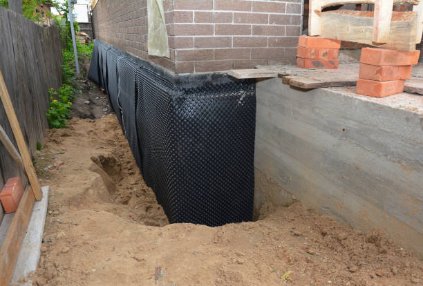 Happy homeowners after waterproofing job in Falls Church